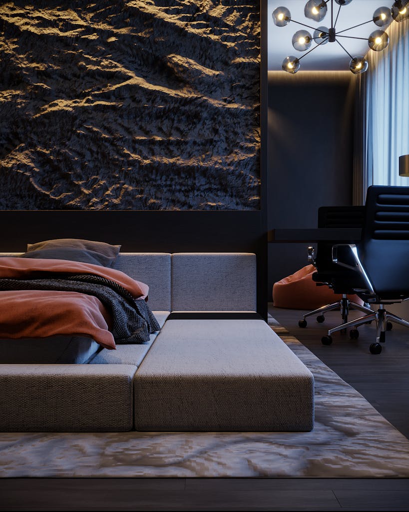 Stylish hotel room with a modern double bed and elegant interior design, perfect for relaxation.
